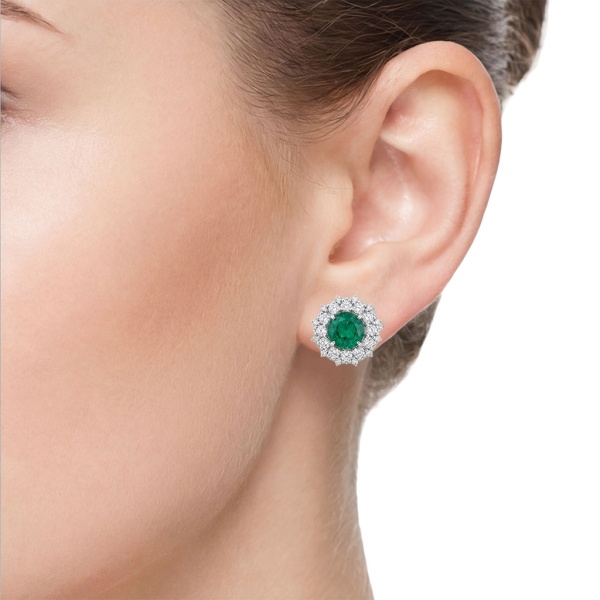 Серьги из белого золота с изумрудпо и бриллиантами